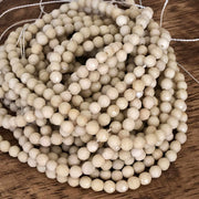 Fossile blanc à Facettes 4mm