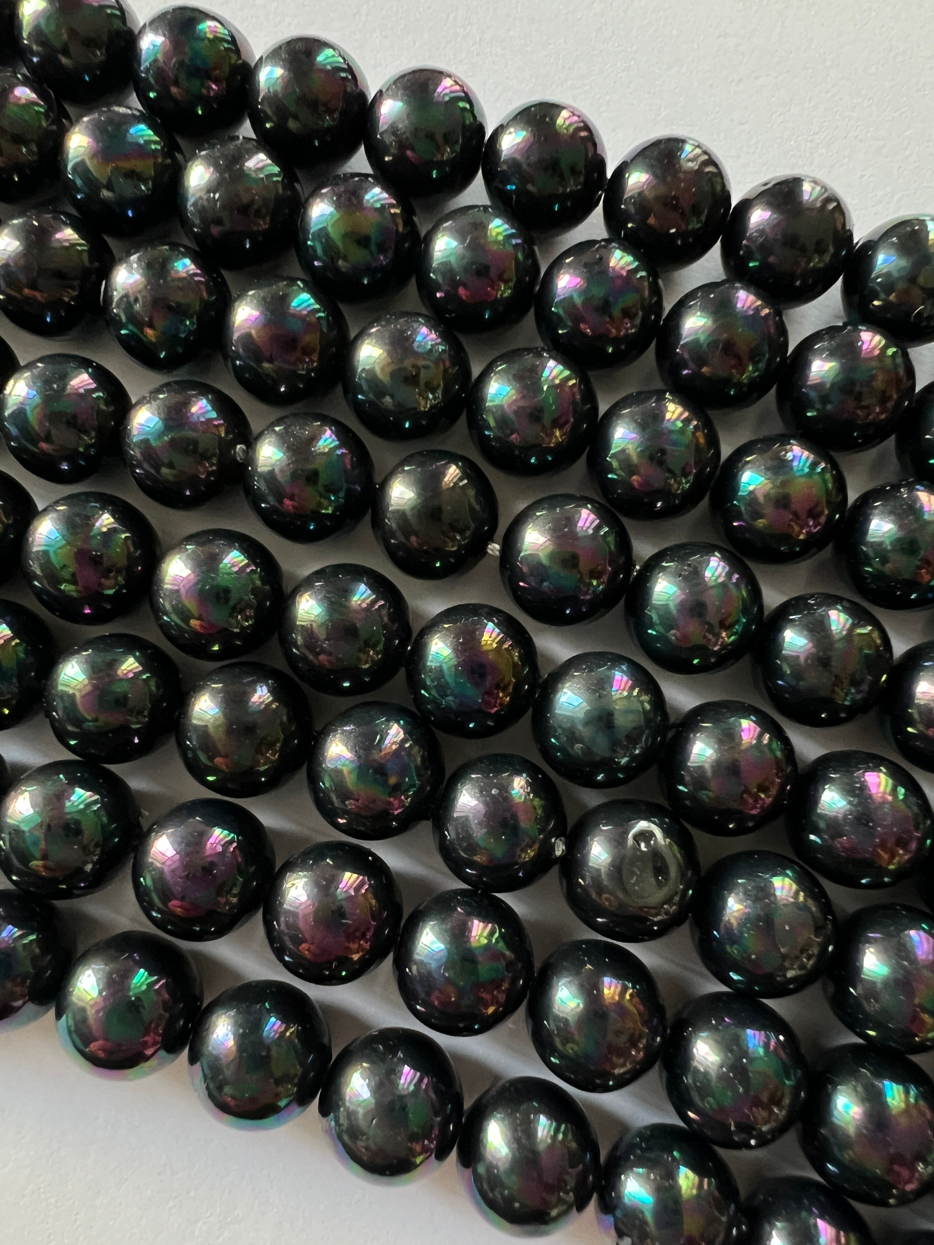 Fil de Perles de Coquillage noires 8mm