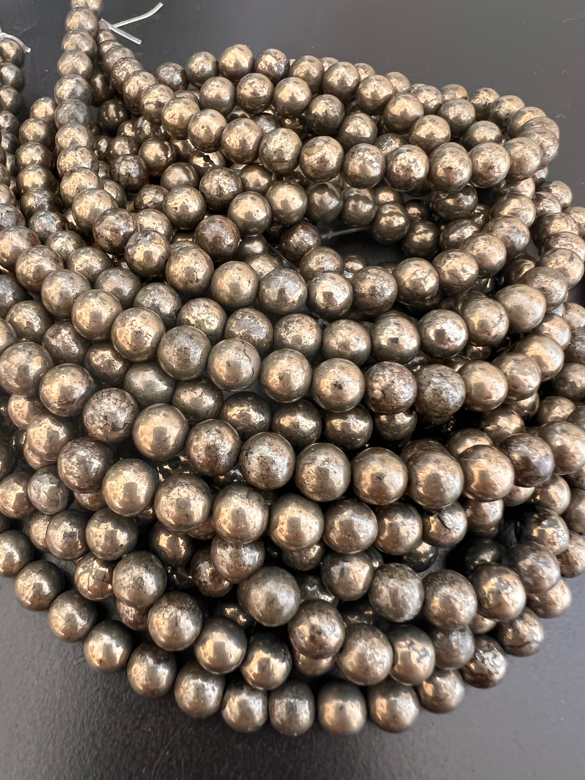 Fil de Perles Rondes en Pyrite 6mm